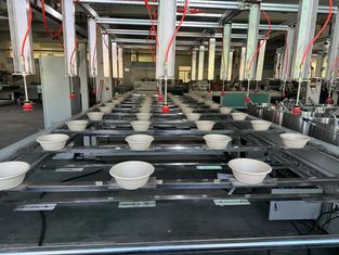 Machine de revêtement à rotation à 24 stations pour produits moulés en pâte à papier