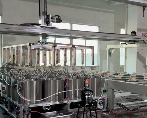 Ligne de revêtement par centrifugation interne pour produits moulés en pâte à papier - Machine de revêtement de précision entièrement automatique