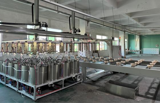 Ligne de production modulaire à haut débit de revêtement par rotation pour barrières internes moulées en pulpe